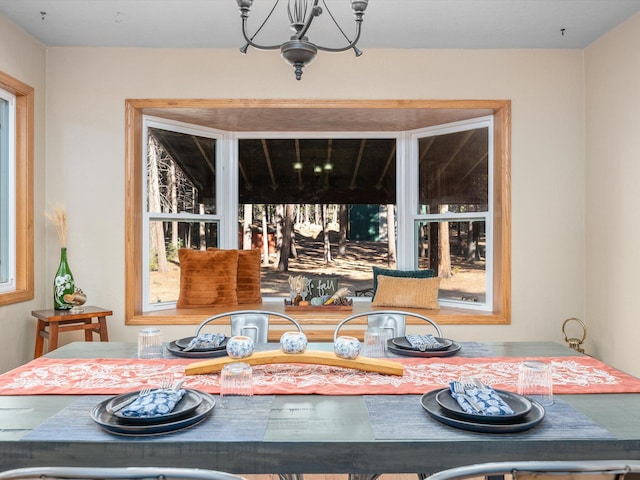 dining area featuring a notable chandelier