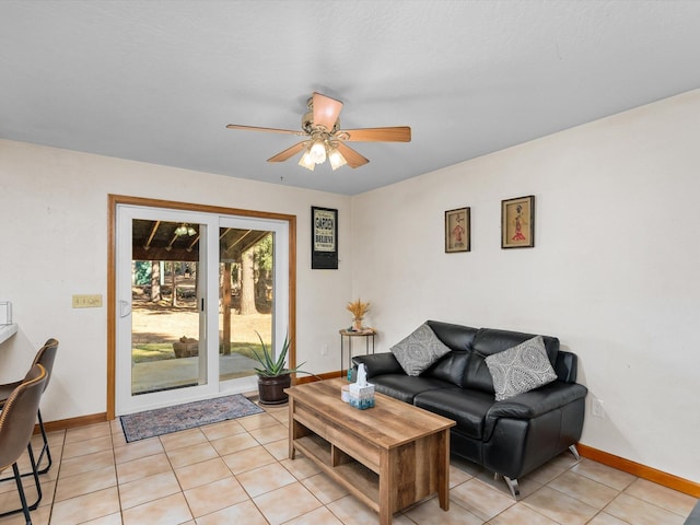 tiled living room featuring ceiling fan