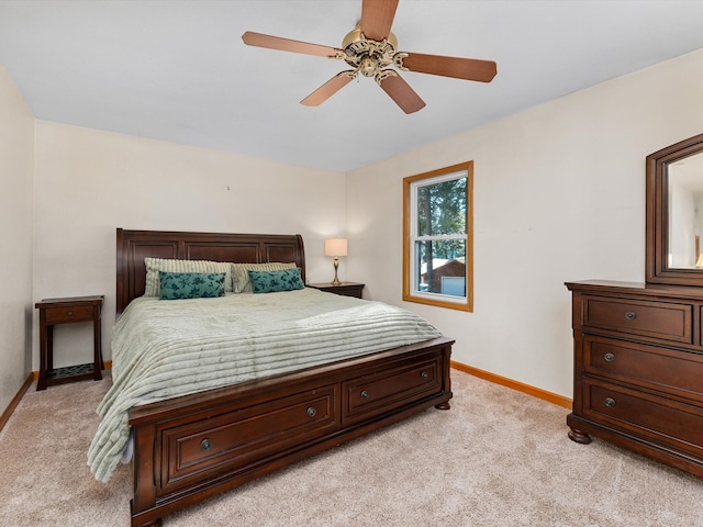 bedroom featuring light carpet and ceiling fan