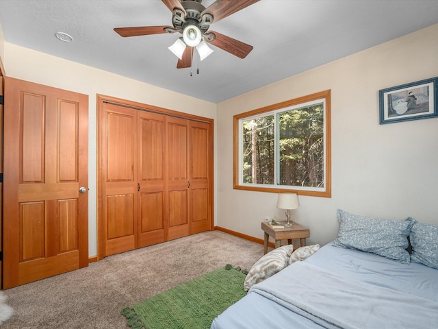 carpeted bedroom with ceiling fan