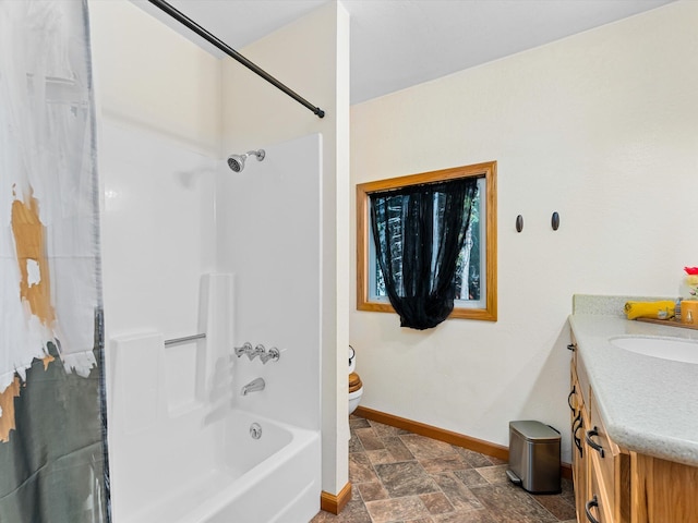 34820 Emigrant Trl, Shingletown, CA 96088 - full bathroom with stone finish flooring, baseboards, vanity, toilet, and shower / bathtub combination