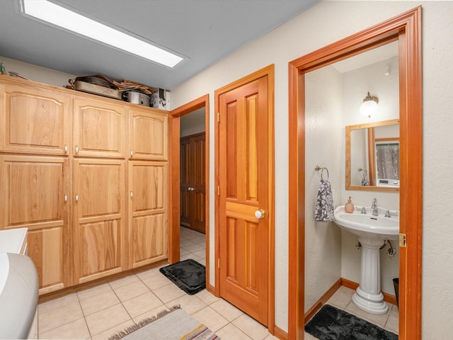 bathroom with tile patterned flooring