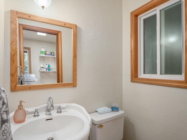 34820 Emigrant Trl, Shingletown, CA 96088 - half bathroom with a sink, toilet, and a textured wall