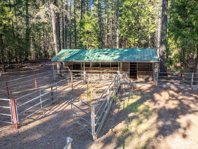 34820 Emigrant Trl, Shingletown, CA 96088 - view of outbuilding with an exterior structure, an outdoor structure, and a wooded view
