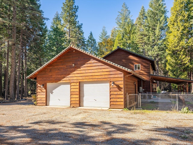 34820 Emigrant Trl, Shingletown, CA 96088 - garage featuring fence and driveway