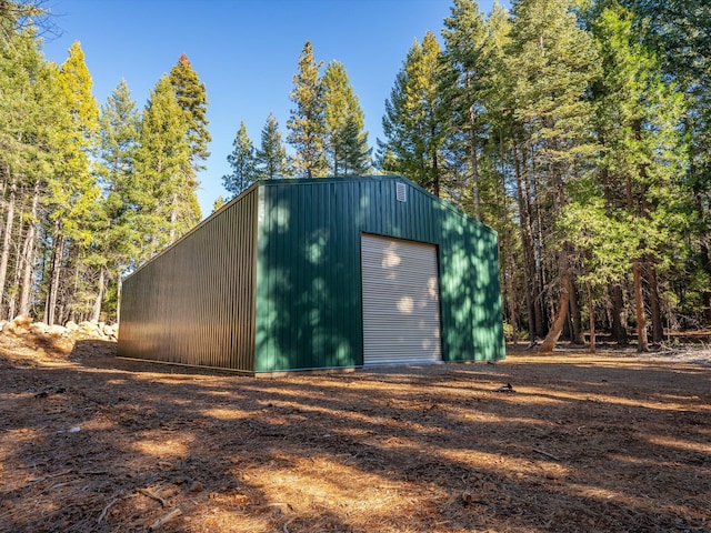 view of outbuilding with a garage