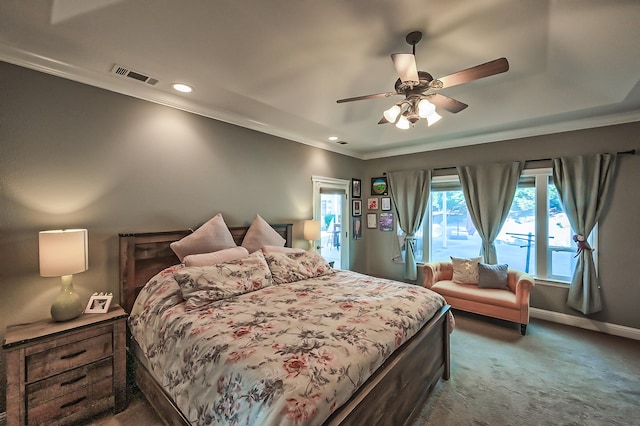 bedroom with ceiling fan, dark colored carpet, and ornamental molding