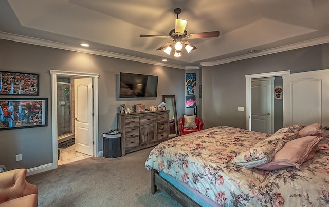 carpeted bedroom featuring ensuite bathroom, ceiling fan, and crown molding