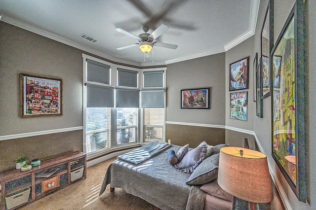 carpeted bedroom with ornamental molding, a textured ceiling, and ceiling fan