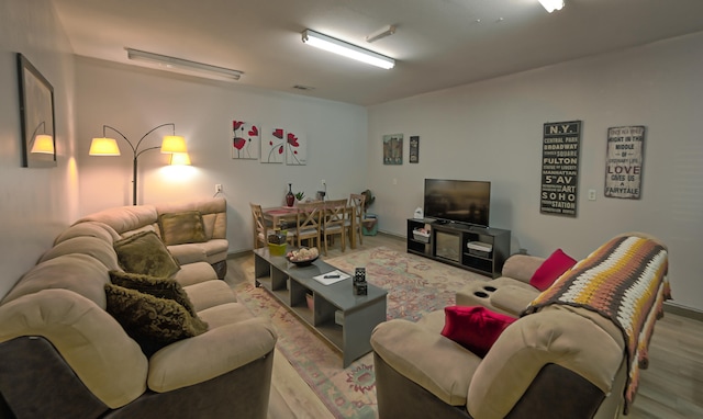 living room with light hardwood / wood-style flooring