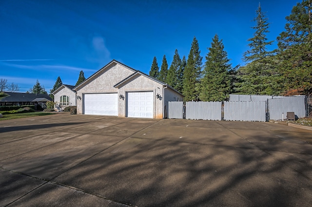 view of side of property featuring a garage