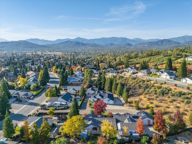 birds eye view of property with a mountain view