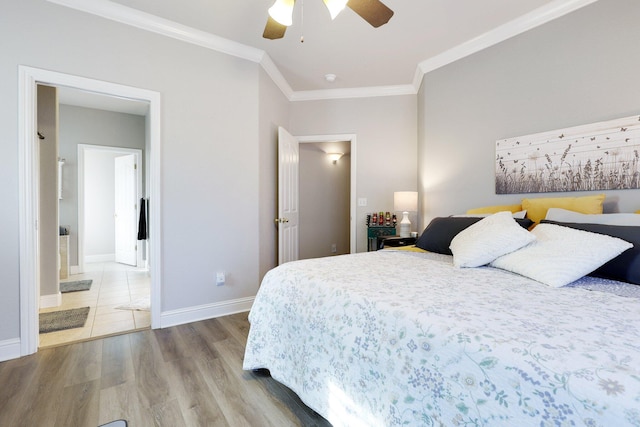 bedroom with hardwood / wood-style floors, connected bathroom, ceiling fan, and crown molding