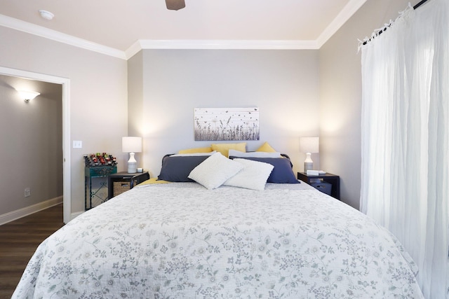 bedroom featuring dark hardwood / wood-style floors, ceiling fan, and ornamental molding