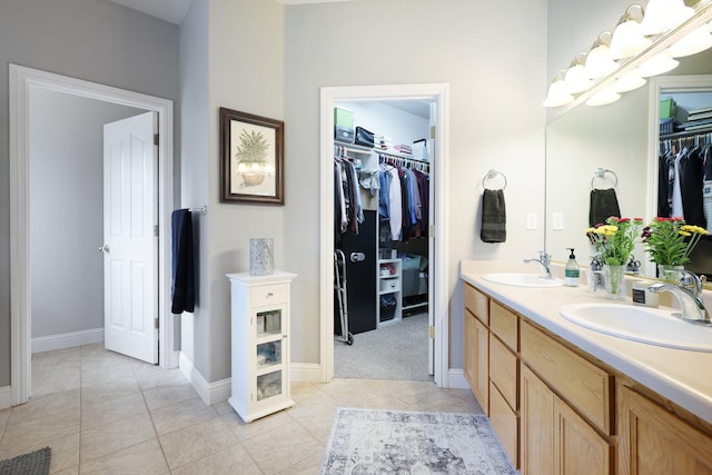 bathroom featuring tile patterned flooring and vanity