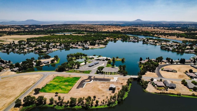 bird's eye view featuring a water and mountain view