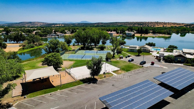 birds eye view of property featuring a water and mountain view