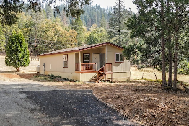 1260 E Weaver Creek Rd, Weaverville, CA 96093 - manufactured / mobile home featuring a wooded view and covered porch