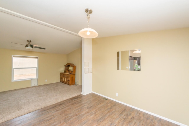 unfurnished living room with hardwood / wood-style flooring and ceiling fan