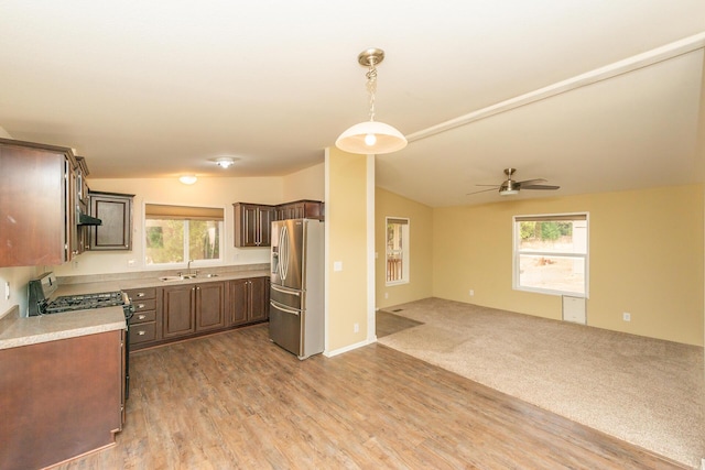 1260 E Weaver Creek Rd, Weaverville, CA 96093 - kitchen with stainless steel fridge with ice dispenser, a sink, open floor plan, light countertops, and black range with gas stovetop