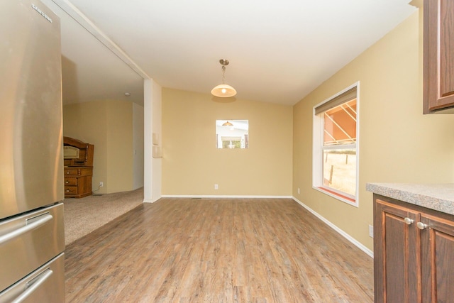 1260 E Weaver Creek Rd, Weaverville, CA 96093 - unfurnished dining area with light wood-style floors, baseboards, and lofted ceiling