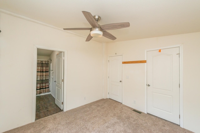 unfurnished bedroom with carpet and ceiling fan