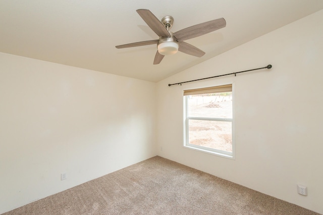 unfurnished room with lofted ceiling, carpet flooring, and ceiling fan