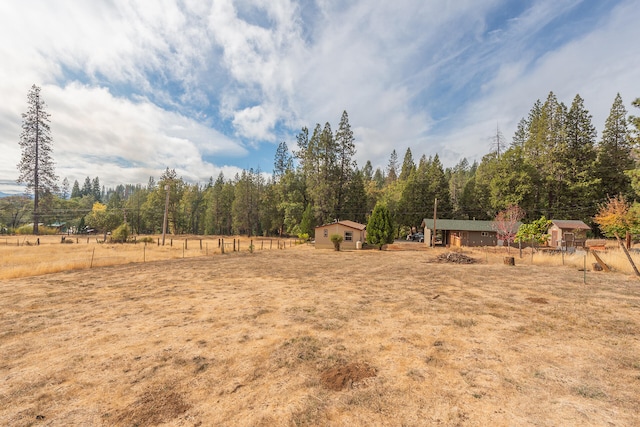 view of yard with a rural view