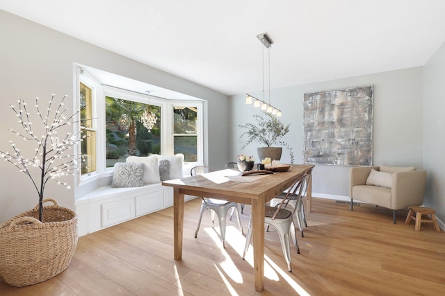 dining space featuring light wood-type flooring