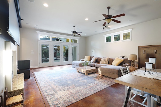 living room with french doors, concrete floors, and ceiling fan