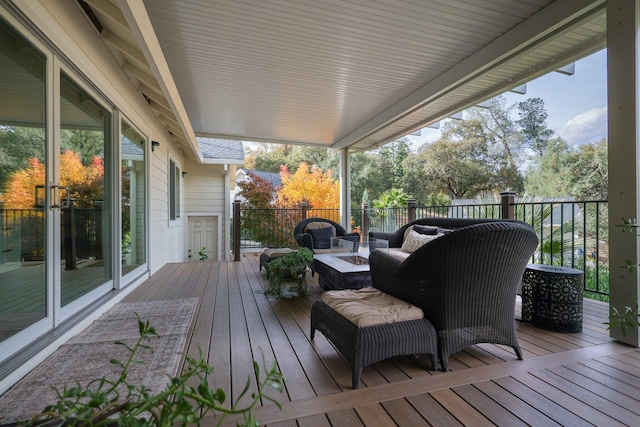 deck with an outdoor fire pit