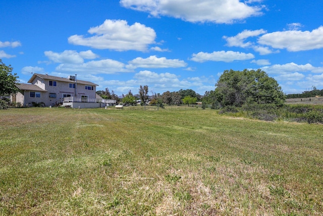 view of yard with a rural view