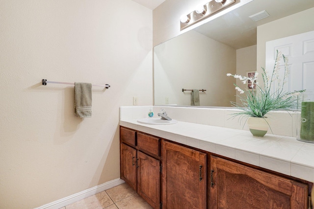 bathroom featuring vanity and tile patterned flooring