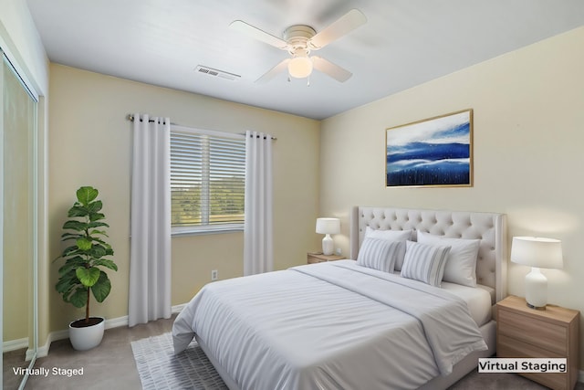 carpeted bedroom with ceiling fan and a closet