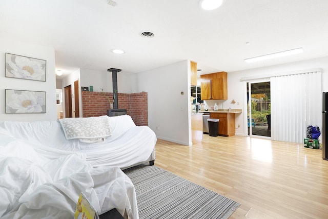 1535 Cordova St, Anderson, CA 96007 - living room featuring a wood stove and light wood-style flooring