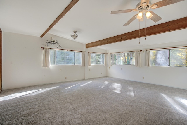 carpeted empty room with vaulted ceiling with beams and ceiling fan