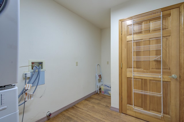 clothes washing area featuring hookup for a washing machine and hardwood / wood-style flooring