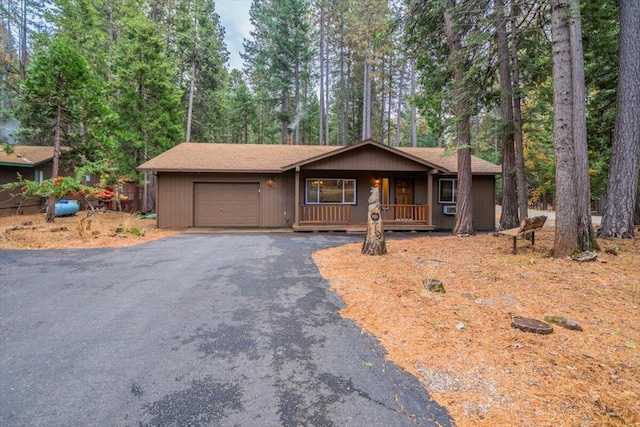 ranch-style house featuring a garage