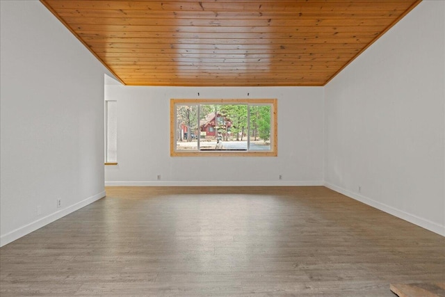 unfurnished room featuring hardwood / wood-style floors, wood ceiling, lofted ceiling, and ornamental molding