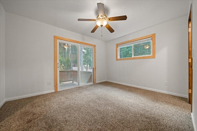 carpeted empty room with ceiling fan