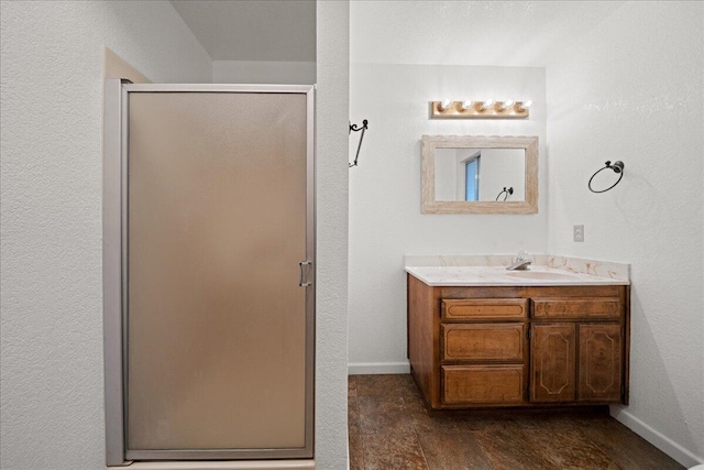 bathroom with vanity and an enclosed shower