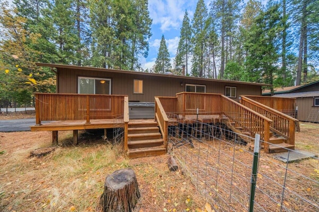 back of house with a wooden deck