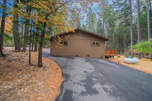 view of home's exterior with a wooden deck