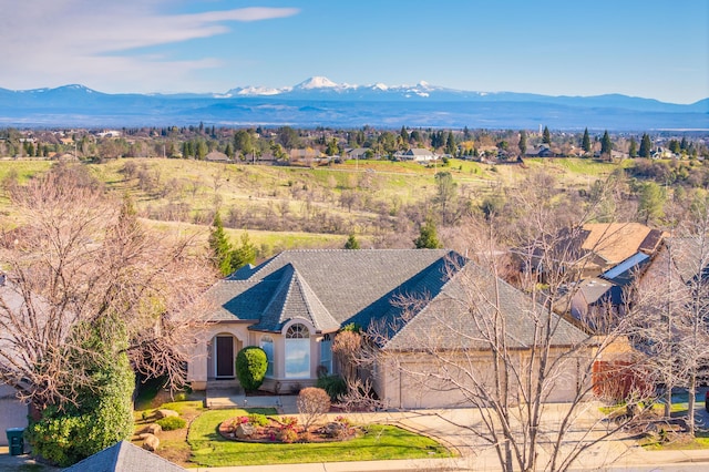 birds eye view of property featuring a mountain view