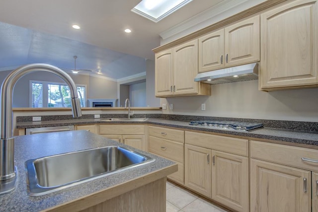 kitchen featuring sink, stainless steel gas cooktop, crown molding, light brown cabinetry, and light tile patterned floors