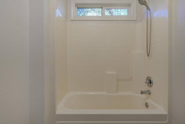 bathroom featuring  shower combination