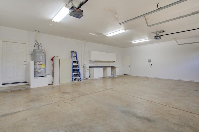 garage featuring secured water heater, a garage door opener, and water heater