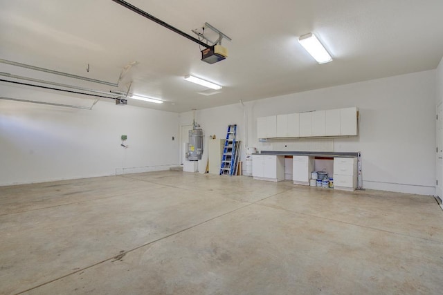 garage featuring a garage door opener and water heater