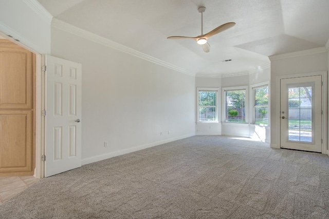 empty room with light colored carpet, ceiling fan, and crown molding