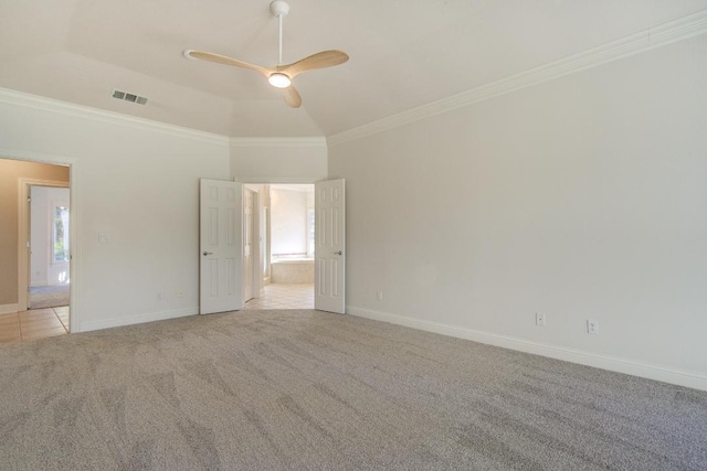 carpeted empty room with a wealth of natural light, ornamental molding, and ceiling fan